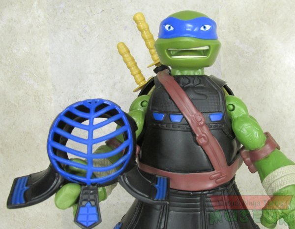 Leonardo holding helmet